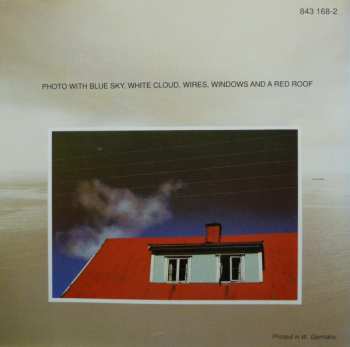 CD Jan Garbarek Group: Photo With Blue Sky, White Cloud, Wires, Windows And A Red Roof